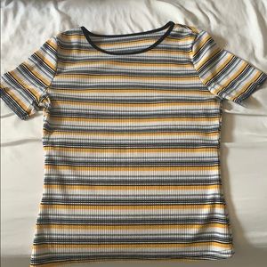 yellow , black and white striped shirt .